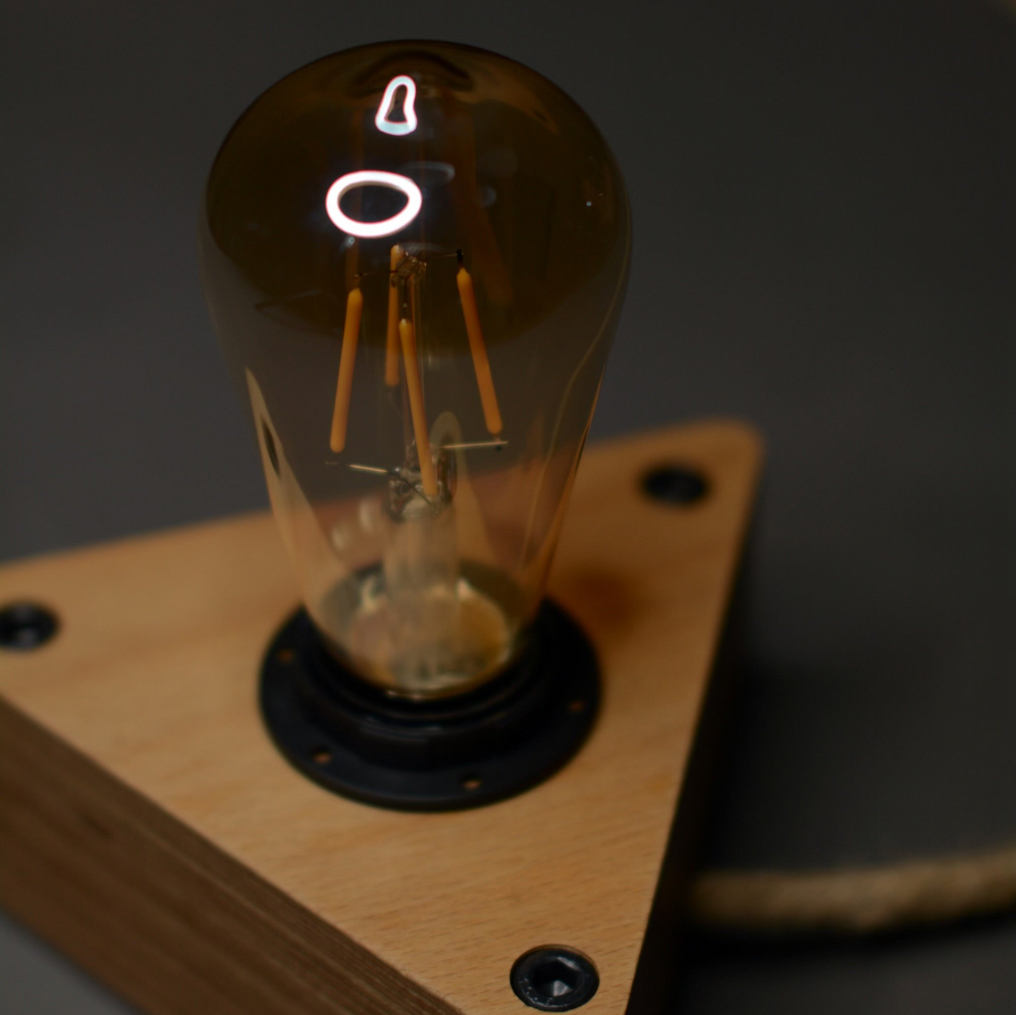 Handcrafted wooden table lamp made from beech, perfect for modern interiors. Luč. Lesena svetilka.